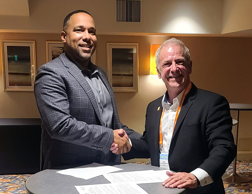 Louis McCall II and Glen Richardson sign a Global MOU on Nov. 11, 2021.